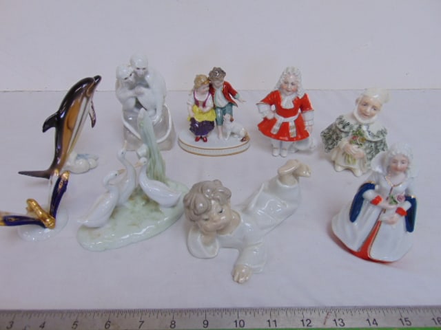 9 porcelain figures, small Capodimonte figure of a boy girl & dog, porcelain figure of two monkeys, (1 of 10)