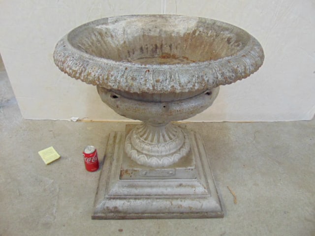 Cast iron garden urn in silver paint, missing handles, in 4 pieces, urn is 26" tall, diameter is 27" (1 of 4)