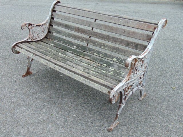 Garden bench with wood slats, iron sides, weathered, 50" long, 27" deep, height is 31", not old. (1 of 4)