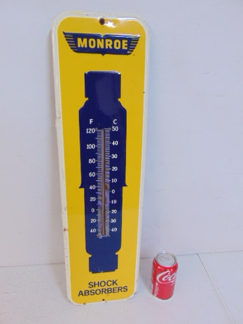 Enameled advertising signed, thermometer, "Monroe Shock Absorbers", some small rust spots, 26.5" by: Enameled advertising signed, thermometer, "Monroe Shock Absorbers", some small rust spots, 26.5" by 7.25"
