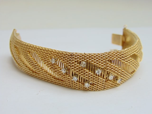 Jewelry. Vintage 14kt gold HERNA bracelet, 52.65 grams, hidden watch accented by 8 small diamonds: Jewelry. Vintage HERNA watch bracelet, 52.65 grams, hidden watch accented by 8 small diamonds approx. 3mm each, prong set. 6 5/8" total length, 17 Jewels INCABLOC, diamonds tested.