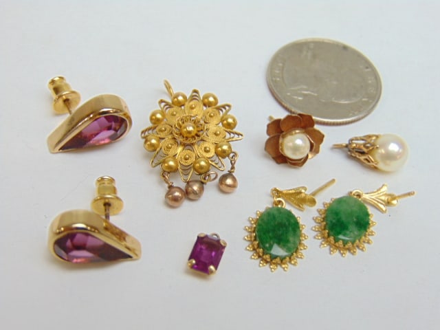 Jewelry. Misc. collection of 10k gold two pairs of earrings, and three single earrings, one tiny (1 of 4)