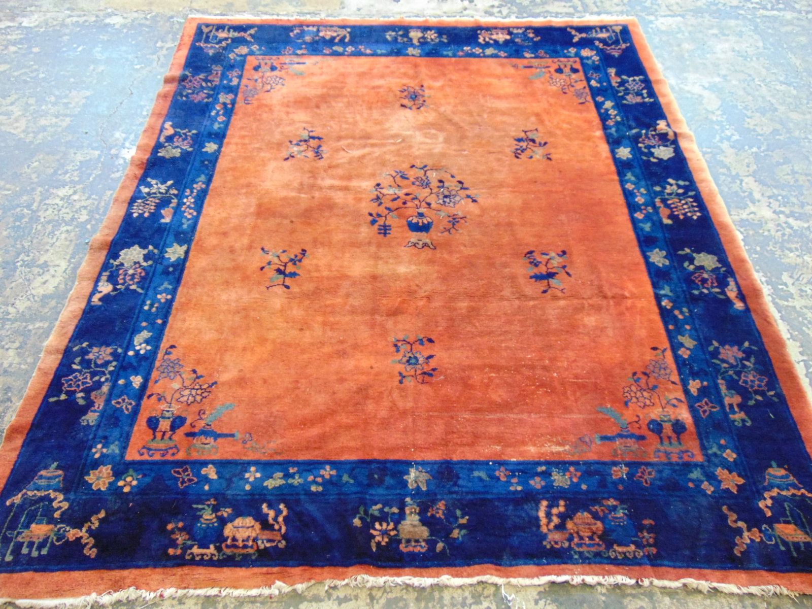 Chinese carpet, salmon colored with blue border, has some wear (moth ?), rug is 8' by 9'6" (1 of 7)