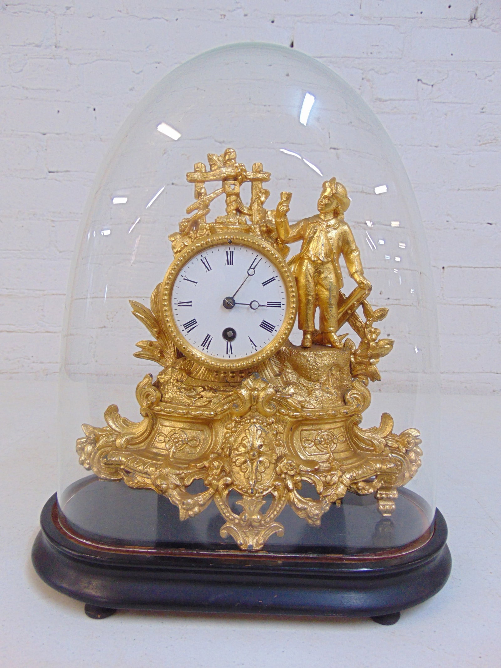 Gilt spelter figural clock under glass dome, with key & pendulum, missing one front "leg", height do (1 of 6)