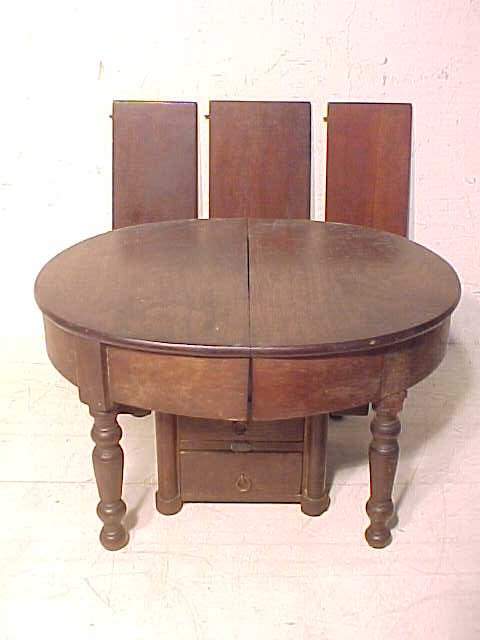 Salesman sample dining table: Salesman sample dining table, extension type with 3 leaves, table is 12.5" long when closed, 7" tall &10.5" wide, two pieces of molding on top of the legs and placed on the skirt are missing, two draw