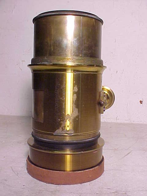 Large brass lens, Optique Francaise Ligny.: Large brass lens, Optique Francaise Ligny, please note that we are not experts when it comes to cameras, these cameras & accessories came from a longtime collector in New Jersey and have been in stora