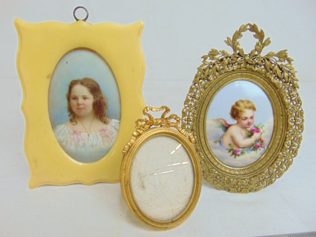 3 pieces, bronze framed porcelain painting of a putty in clouds, small oval gilt bronze frame by P. (1 of 8)