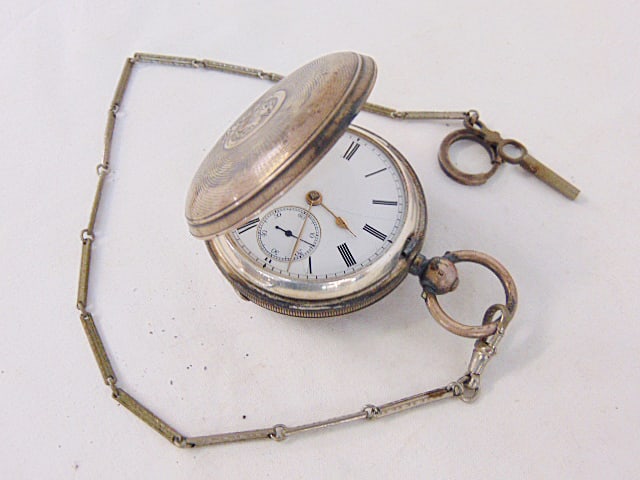 Silver pocket watch, keywound, with key, watch is not in running condition, missing crystal (1 of 3)