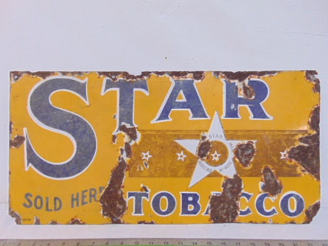 Enameled advertising sign, "Star Tobacco", has loss in corners, various rust spots, vintage 11.75": Enameled advertising sign, "Star Tobacco", has loss in corners, various rust spots, vintage 11.75" by 24"