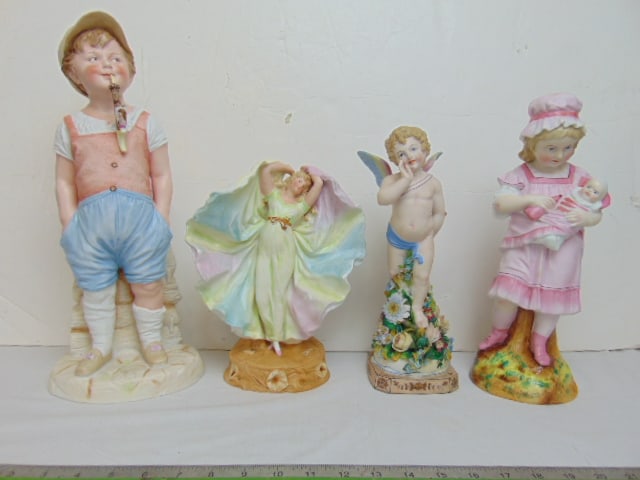4 bisque porcelain figurines, winged putti on floral base, 11" tall (repaired), woman holding up her (1 of 10)