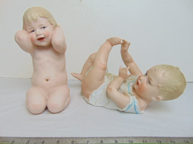 Two large bisque porcelain Heubach baby figurines, 12" long, 9.75" tall, one has finger missing (1 of 6)