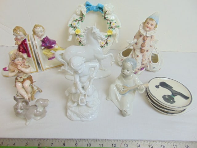Lot misc. porcelain, wall pocket with flanking putti, pair figural bookends, boy in clown pajamas, (1 of 12)