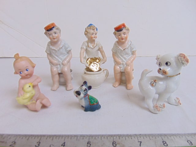 6 small porcelain novelty pieces, figurines, includes 3 potty babies (Geldenscheissens), small cupid (1 of 6)