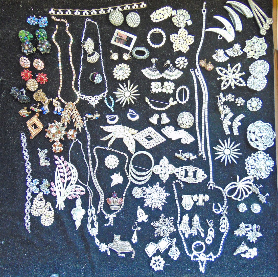 Jewelry. Collection of Vintage Rhinestone pins, earrings, buckles, bracelets, two Otis sterling CZ: Jewelry. Collection of Vintage Rhinestone pins, earrings, buckles, bracelets, two Otis sterling CZ tennis bracelets one stone missing, Otis sterling necklace CZ, & more
