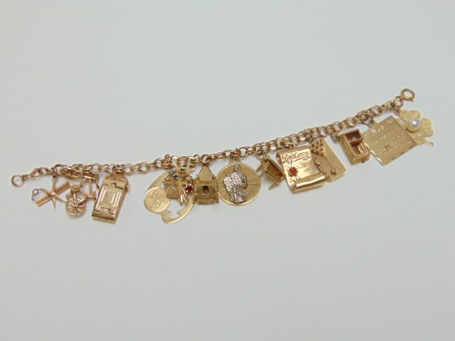 Jewelry. Vintage GOLD charm bracelet, 13 charms, all 14k, 40 grams total weight, charms hallmarked (1 of 9)