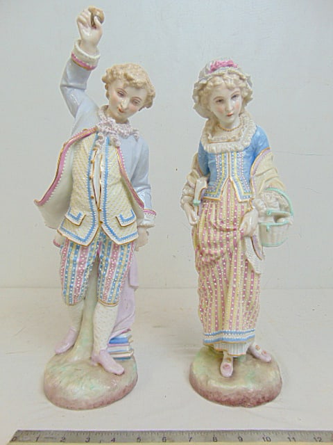 Pair French porcelain figures, Vion & Baury anchor mark, maid with basket & book & man holding: Pair French porcelain figures, Vion & Baury anchor mark, maid with basket & book & man holding acorn, height is 15 5/8" & 18", both in good condition