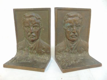 Pair Theodore Roosevelt bronze bookends, 4" wide, 5 3/8" tall, 2.5" deep