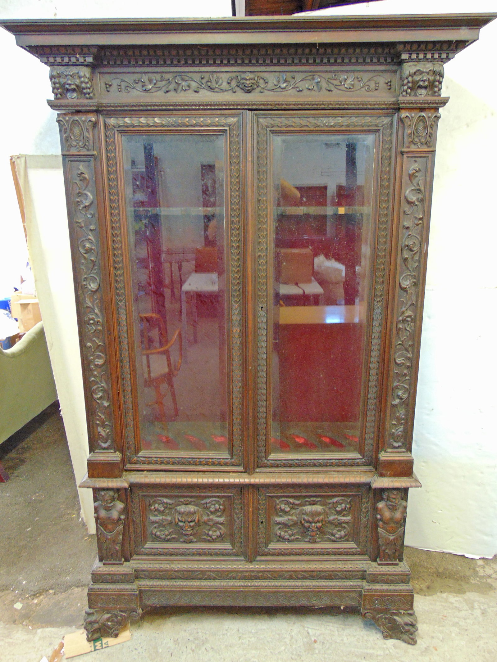 Double door carved oak gun cabinet, two door base, two glass door top, nicely carved with various (1 of 13)