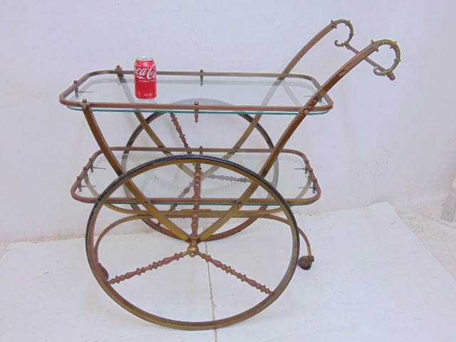 Brass tea cart with two glass shelves, small chip on one shelf, large wheels, bar cart is 38" long, (1 of 5)