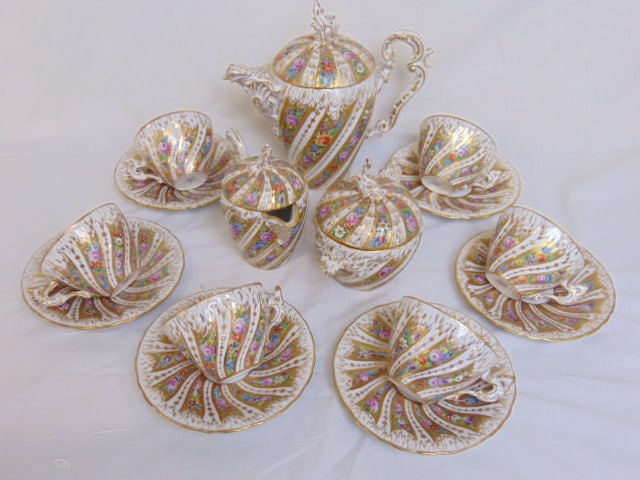 Porcelain tea set marked "Meissen", 6 cups & saucers, teapot, sugar & creamer, floral decorated with (1 of 6)