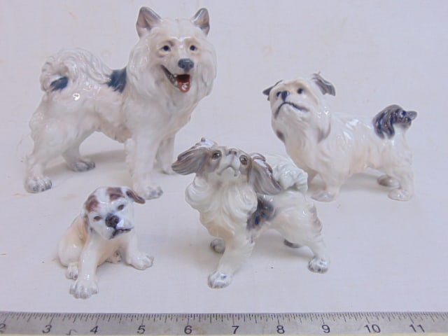 4 porcelain dog figurines by Dahl Jensen, largest dog in this lot is 7" wide, 6.25" tall, all in: 4 porcelain dog figurines by Dahl Jensen, largest dog in this lot is 7" wide, 6.25" tall, all in good condition
