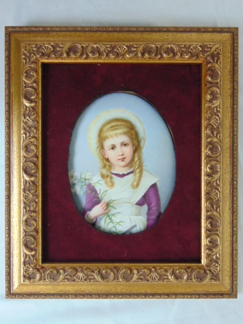 Porcelain plaque, girl holding flower, various (Swiss) paper labels on reverse, oval plaque is 7.75": Porcelain plaque, girl holding flower, various (Swiss) paper labels on reverse, oval plaque is 7.75" by 5", in red velvet lined frame, framed size is 12 1/8" by 10 3/8"