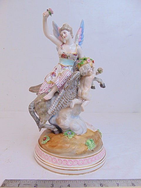 Meissen porcelain figure, winged woman riding Pegasus with cherubs offering her flower baskets,: Meissen porcelain figure, winged woman riding Pegasus with cherubs offering her flower baskets, height is 12.25", various repairs restored, repaired condition
