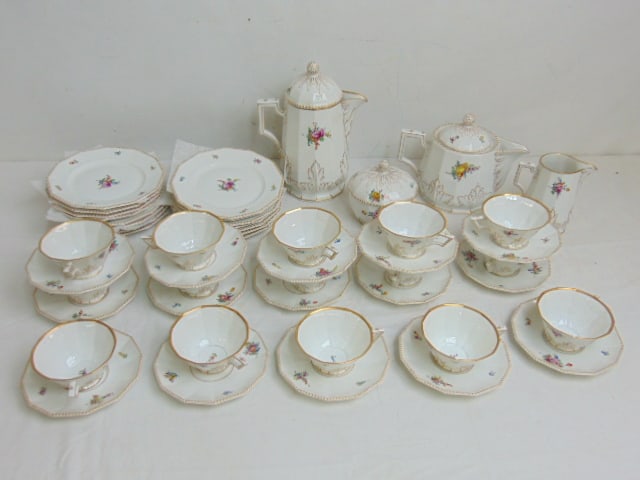 Nymphenburg porcelain tea set, floral decorated with gilt trim, includes 15 bread plates, 15 cups & (1 of 8)