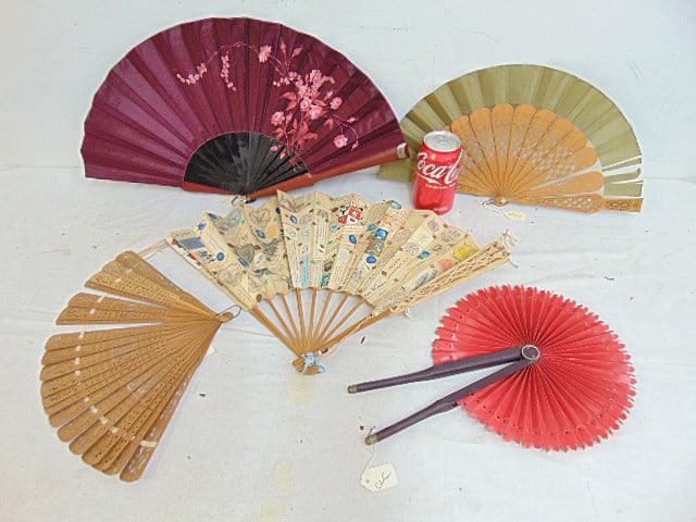 5 folding fans, one floral decorated red fan with leather (?) covered sides, 2 pierced wood fans, (1 of 13)