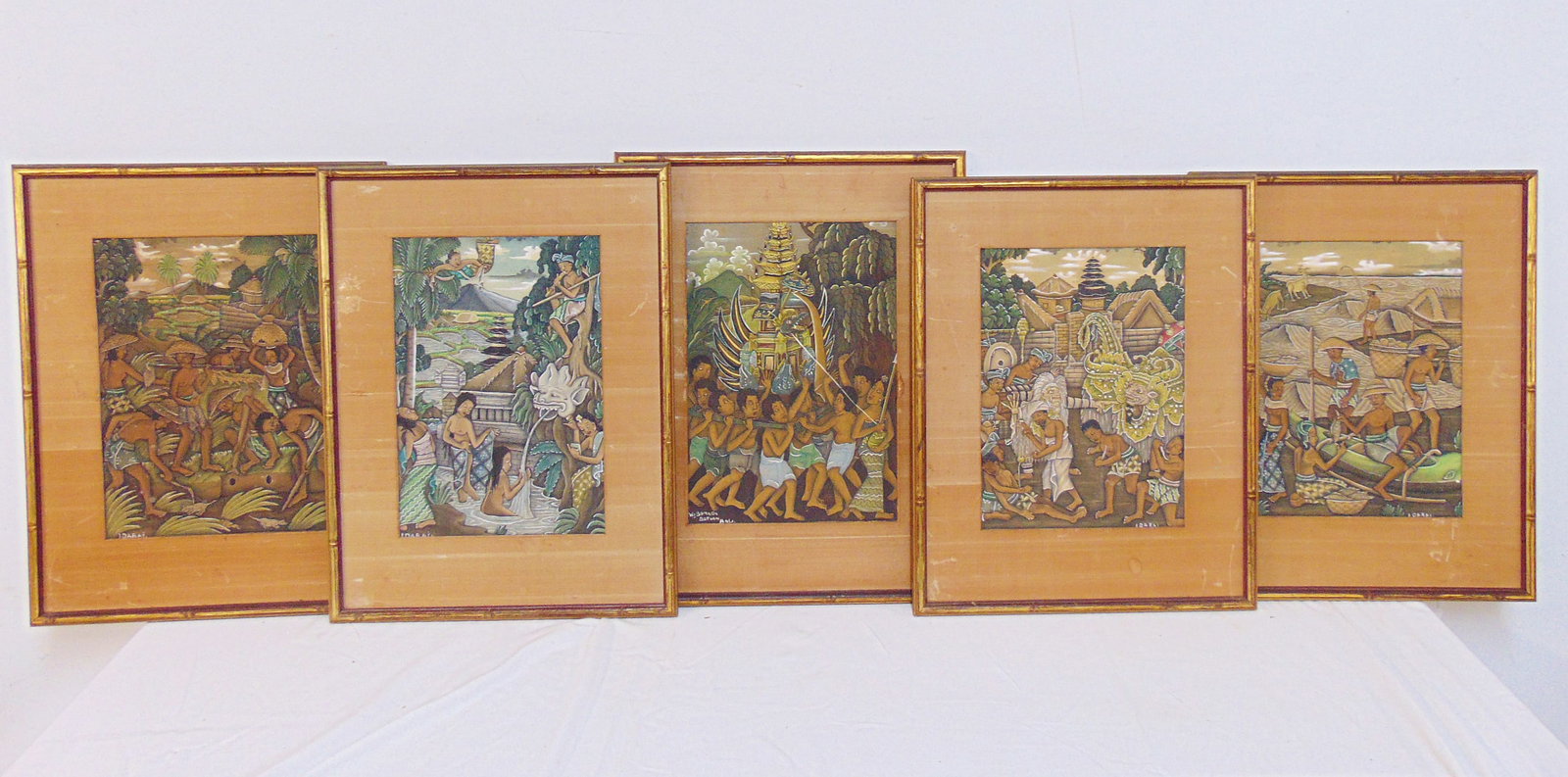 Set of 5 Balinese paintings, 4 signed Idarai one signed W.J. Bomada, Batuan, Bali, sizes vary but: Set of 5 Balinese paintings, 4 signed Idarai one signed W.J. Bomada, Batuan, Bali, sizes vary but are between 10.5" & 11.5" by 7.5" to 8" (sight)