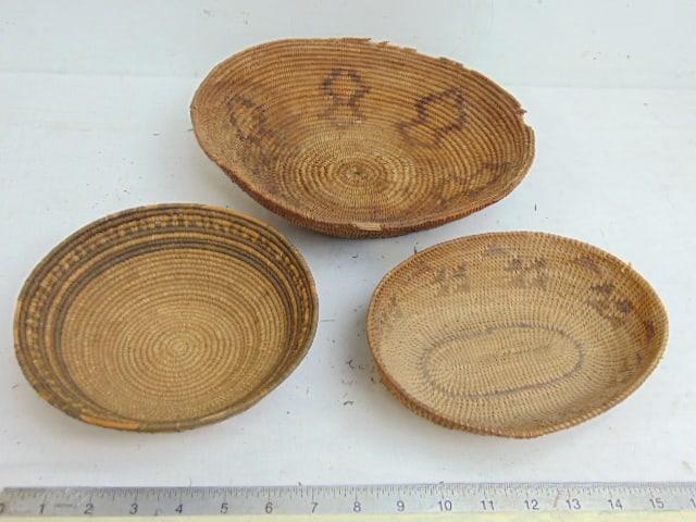 3 Native American woven coil baskets, 2 round, one oval reed basket, large round basket is 11.25",: 3 Native American woven coil baskets, 2 round, one oval reed basket, large round basket is 11.25", has loss on edge, oval basket is 8" by 6.25"small round basket with decorative edge is 7 3/8", has so