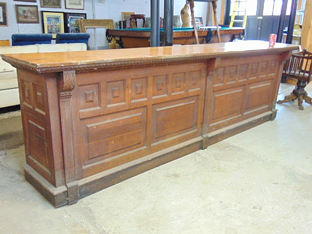 Large oak country counter, paneled front & sides, from Highland Falls store, 12 feet long, depth is: Large oak country counter, paneled front & sides, from Highland Falls store, 12 feet long, depth is 24", height is 36"