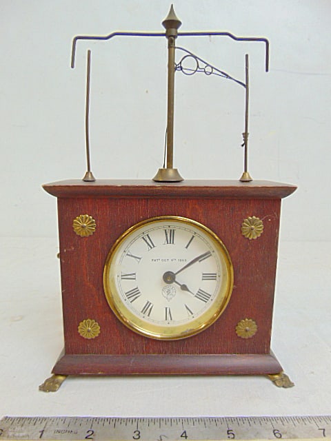 Jerome & Co Horolovar or Flying pendulum clock, wood case with brass claw feet, patented Oct 9th (1 of 6)