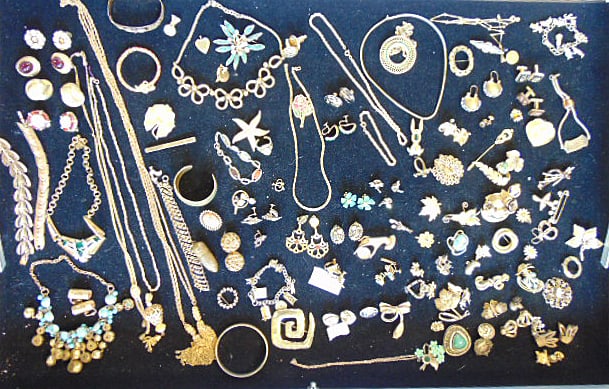 Jewelry. Large collection of gold tone costume jewelry to include signed pieces, Haskell; Trifari; (1 of 8)