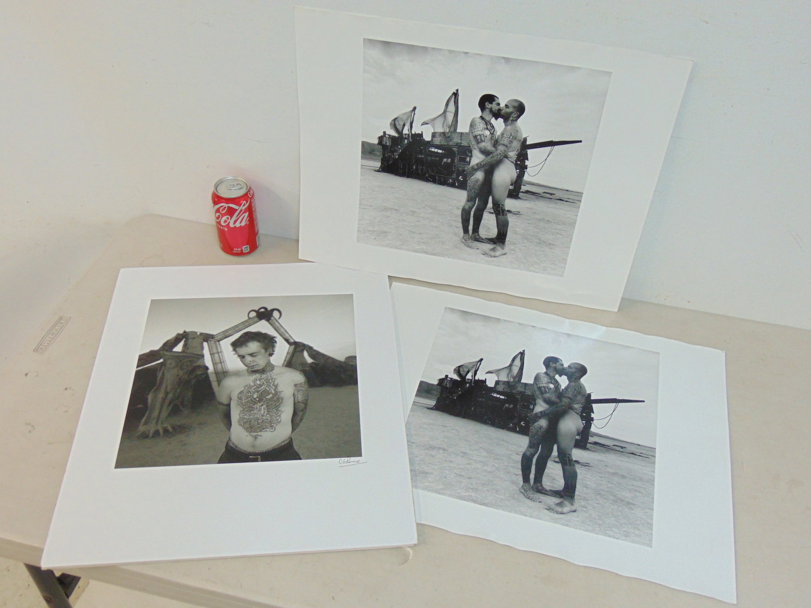 3 photographs by Chris Rainier, "Modern Primitive" Burning Man, Black Rock Desert, one is signed, 16 (1 of 4)