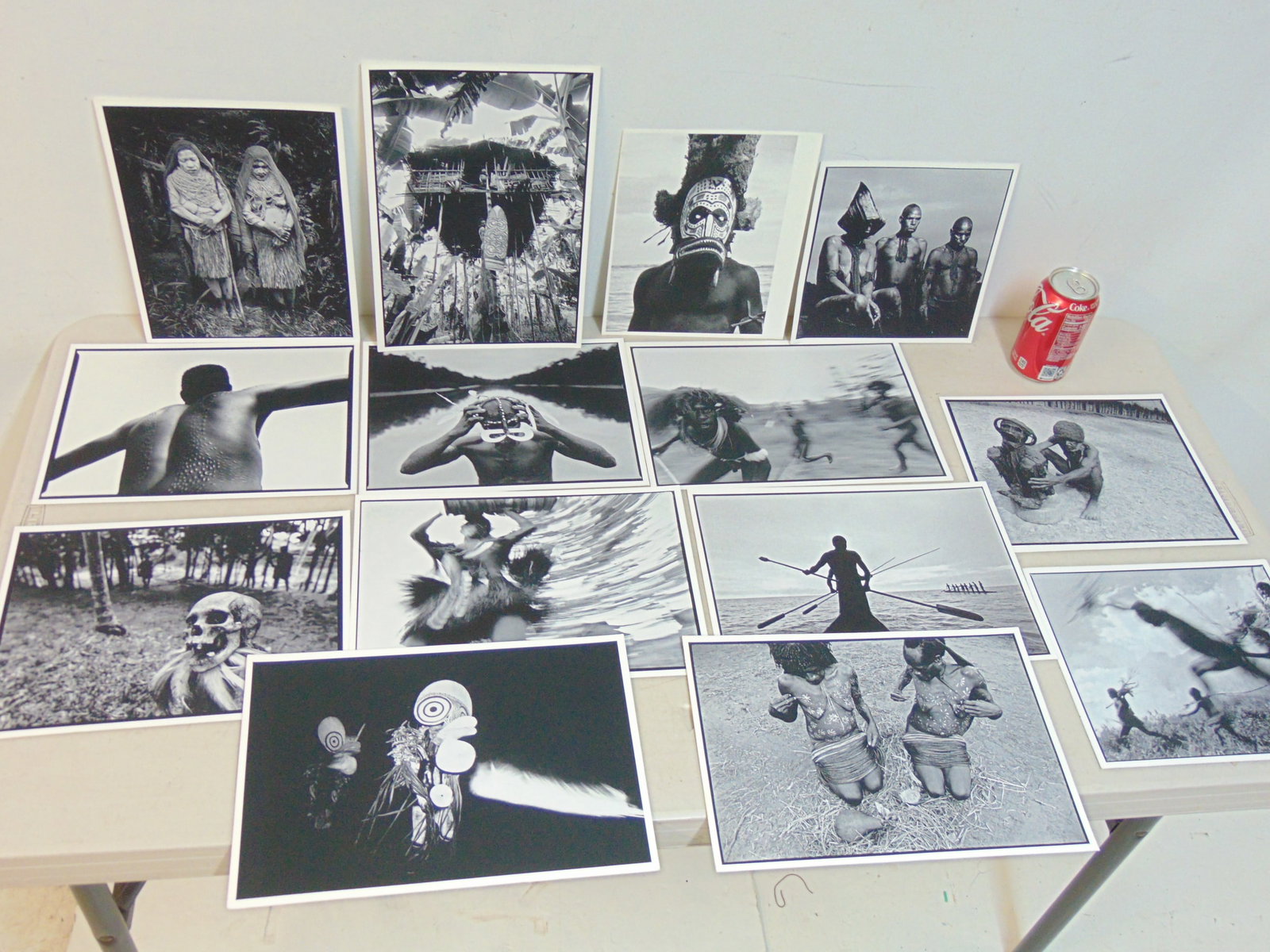 14 photographic prints by Chris Rainier, on thick matte paper, various indigenous, tribal scenes: 14 photographs, Iris prints (?) by Chris Rainier, on thick matte paper, various indigenous, tribal scenes, various sizes, but most are 8.5" by 11.5", unsigned. Chris Rainier served as the last assista