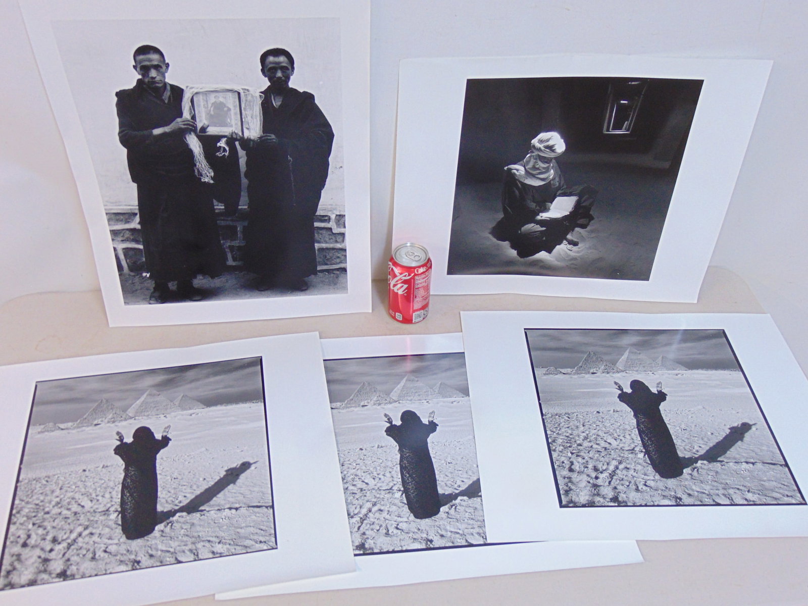 5 large photographs (Iris Prints), Chris Rainier, includes 3 copies of "Woman Honoring the Great Pyr: 5 large photographs (Iris Prints), Chris Rainier, includes 3 copies of "Woman Honoring the Great Pyramids", "Tuareg reads sacred text, Mali", & Buddhist Monks, 20" by 16" each (sheet) Chris Rainier se