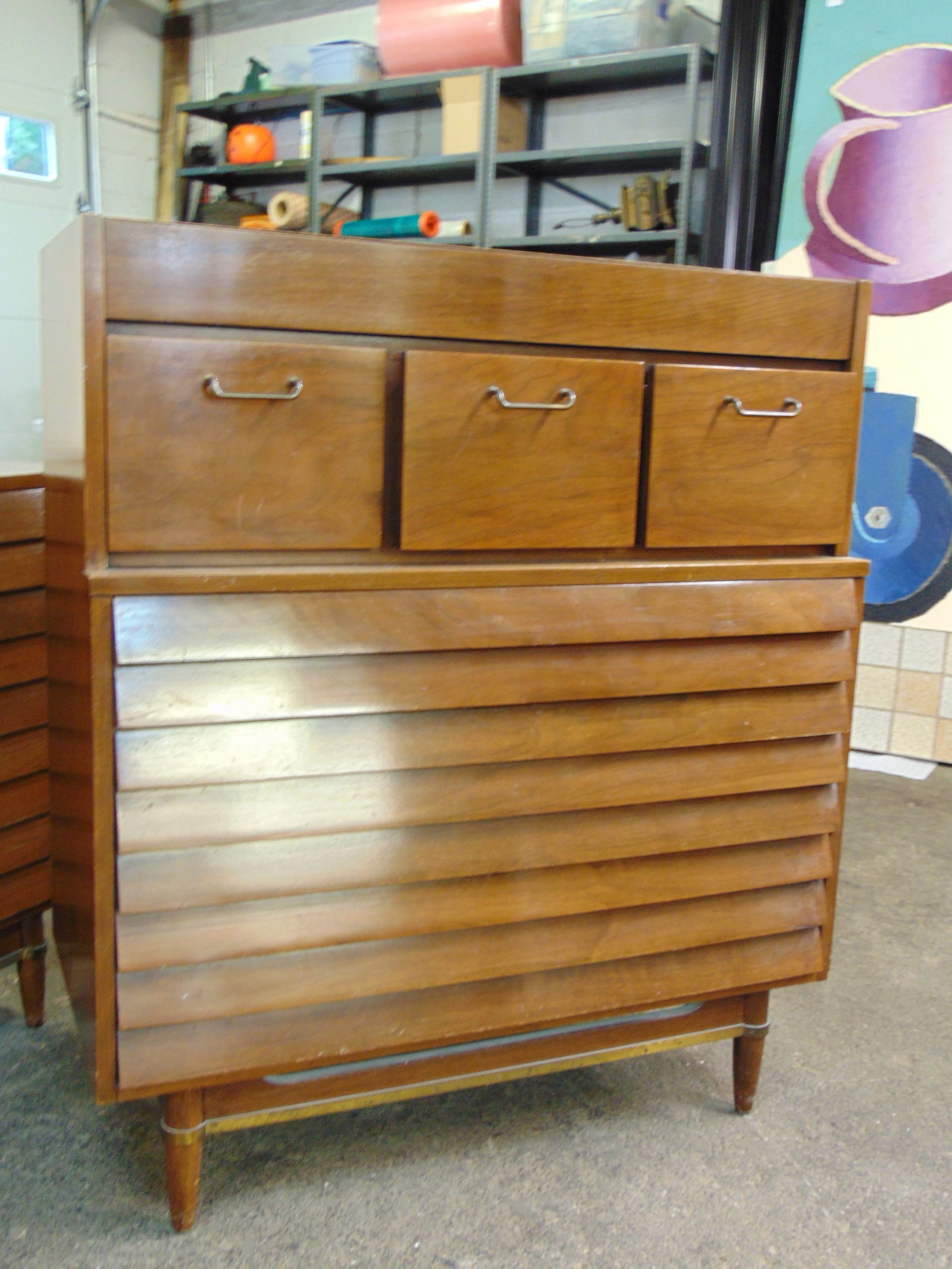 American of Martinsville Dania Mid Century chest of drawers, tall 3 over three chest, chest is 38" w: American of Martinsville Dania Mid Century chest of drawers, tall 3 over three chest, chest is 38" wide, 19" deep, height is 44.25", has veneer chip lower right side. Note, by request this lot, origin