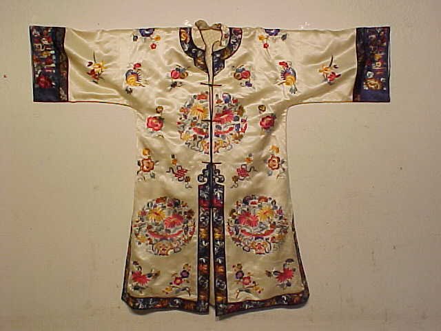 Vintage silk Chinese embroidered jacket: Silk Chinese jacket, white with embroidered sleeves. Note, all clothing is vintage and has varying degrees of stains, wear & tears or other damage, all clothing articles are offered as is.