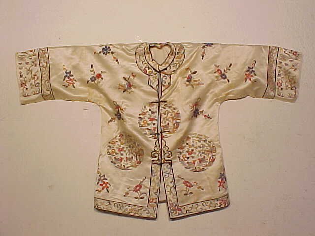 Vintage Chinese embroidered silk jacket: Chinese embroidered silk jacket. Note, all clothing is vintage and has varying degrees of stains, wear & tears or other damage, all clothing articles are offered as is.