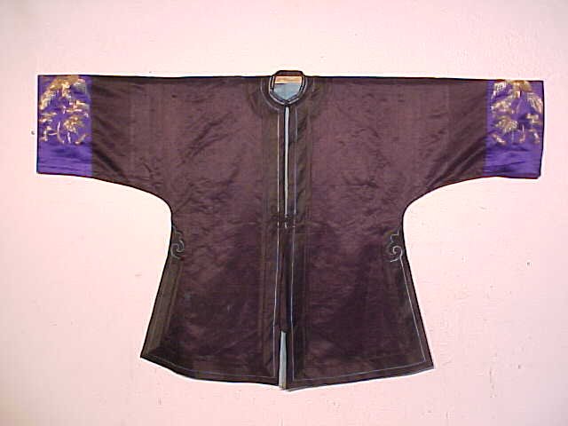 Vintage Chinese jacket, black: Chinese jacket, black with embroidered sleeves. Note, all clothing is vintage and has varying degrees of stains, wear & tears or other damage, all clothing articles are offered as is.