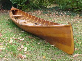 Adirondack guide boat by Steve Kaulback: A fine sailing Adirondack guide boat by Steve Kaulback, minor scratches on hull, caned folding seats, comes with multiple sets of oars, 15 feet long and 40" wide at the center, note, this item was sol
