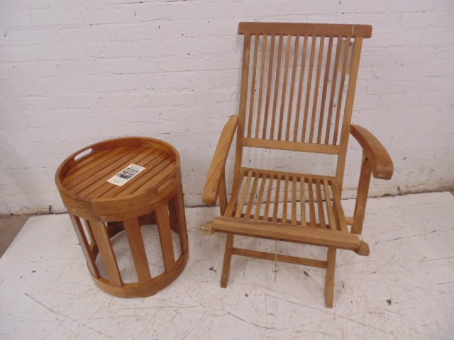 Teak folding chair & table frm Wolf of Wall St set: Outdoor classics teak folding chair with Westminster Katelonia side table Condition: chair needs arm reattached, and small crack in side table Provenance: Prop/Set Design from The Wolf of Wall Street 