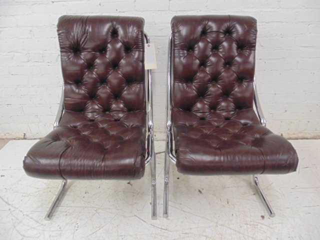Pr tufted leather &chrome chairs, Wolf of Wall St movie: Pair tufted leather & chrome chairs, Jordan's office set Condition: Some slits in the leather and some corrosion to chrome bases. Provenance: Prop/Set Design from The Wolf of Wall Street Academy Award
