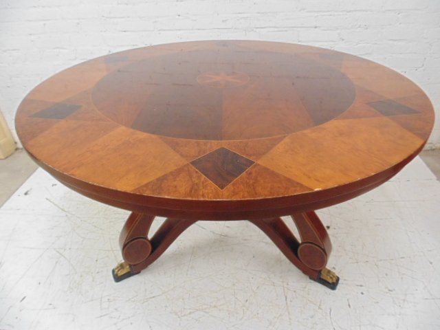Fine inlaid Widdicomb table, Wolf of Wall St Movie Set: Fine inlaid Widdicomb center table, Jordan's office Condition: scratches to top, some veneer loss to edges Dimensions:48" diameter, 30" tall Provenance: Prop/Set Design from The Wolf of Wall Street Ac