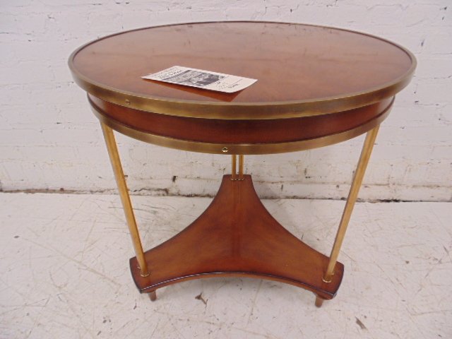 Brass mounted mahogany table, frm Wolf of Wall St movie: Round brass mounted mahogany table, Jordan's office Condition:good Dimensions: 23.75"diameter by 25.75" tall Provenance: Prop/Set Design from The Wolf of Wall Street Academy Award nominated movie