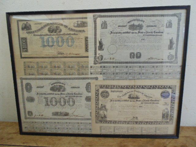 4 Civil War Confederate States of America bonds, NC: 4 Confederate States of America bonds with coupons, North Carolina, 3 One Thousand Dollar bonds and 1 Five Hundred Dollar bond, All four are dated 1862, All four are signed. Condition: framed with som