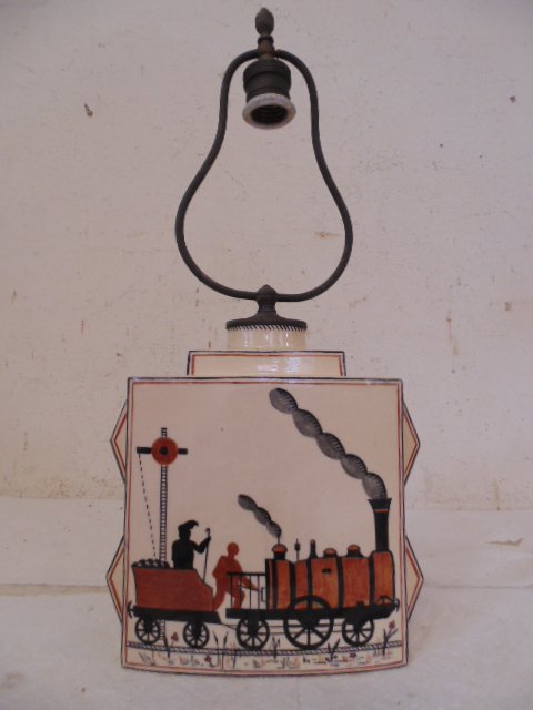 Robert Lallemant porcelain lamp train scene: Robert Lallemant porcelain lamp with train scene Dimensions: 8.75" tall, porcelain only, 8.25" wide, 3 5/8" deep