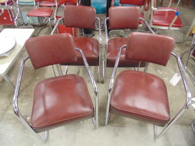 Set 4 red & chrome chairs: Set 4 red & chrome chairs. Chrome has some pitting, chairs are worn. This lot is part of a collection of machine age chrome by makers Royalchrome, Chrometube, Warren MacArthur, Russel Wright, Wolfgang