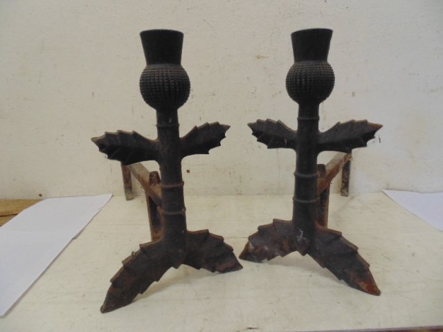 Pair cast iron "thistle" andirons: Pair of thistle themed andirons, 16" tall, in original condition, some rust.Please note that participation in this Auction held at Hudson Valley Auctioneers, whether in person, by phone, via absentee 